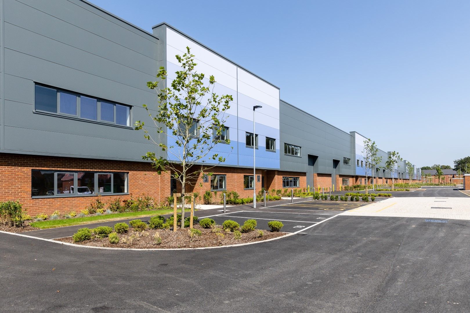 Forge Wood building in Crawley with landscaped car park and newly planted trees
