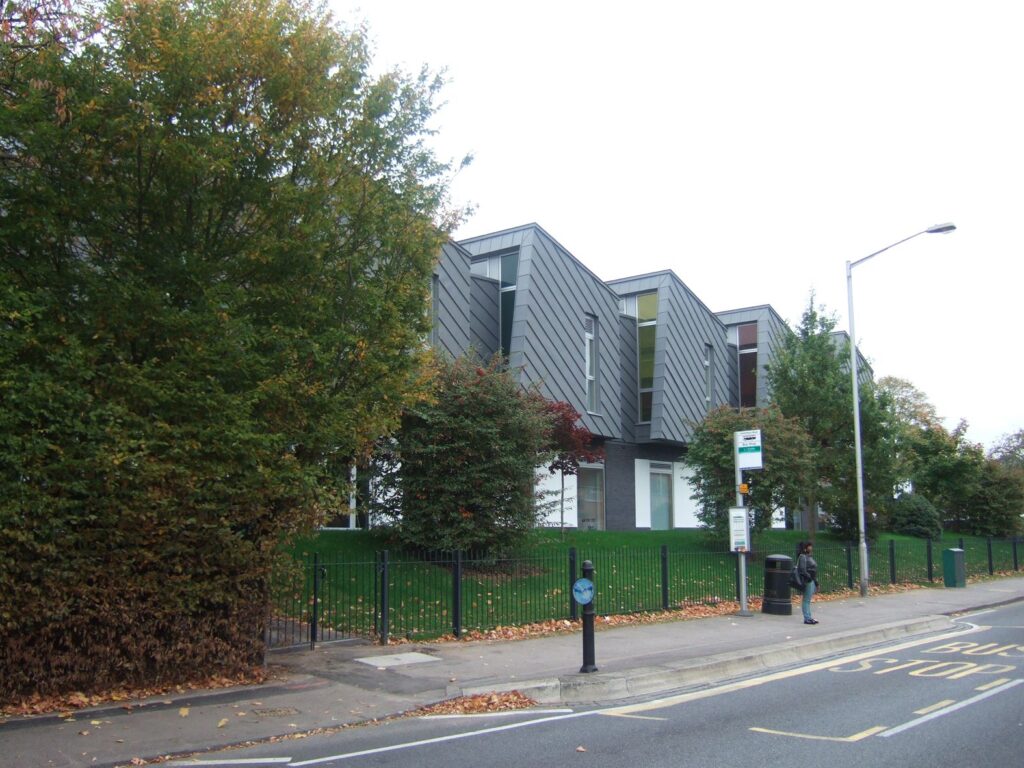 Reading Girls School seen from the street behind retained trees